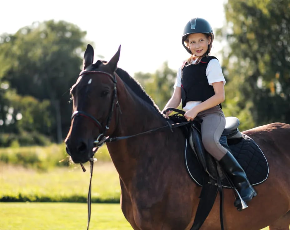 a girl riding a horse