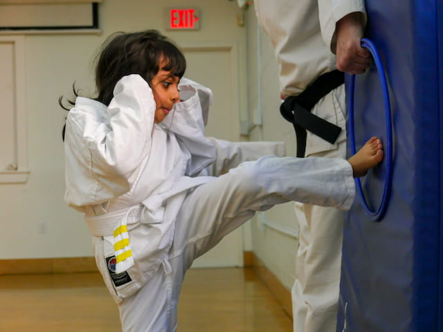 a man in a karate uniform