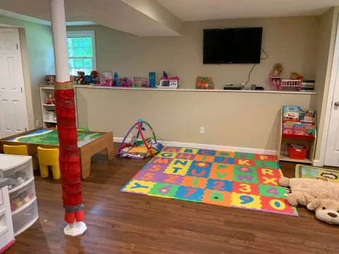 a room with a tv and toys