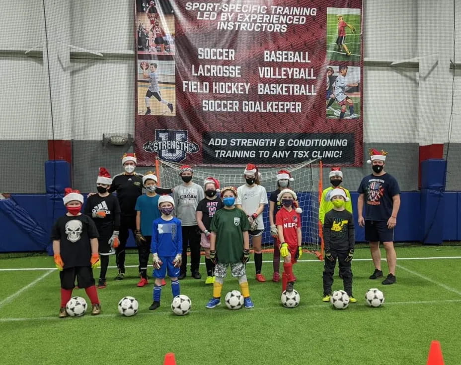 a group of kids playing football