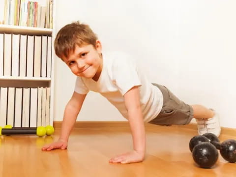 a baby playing with balls