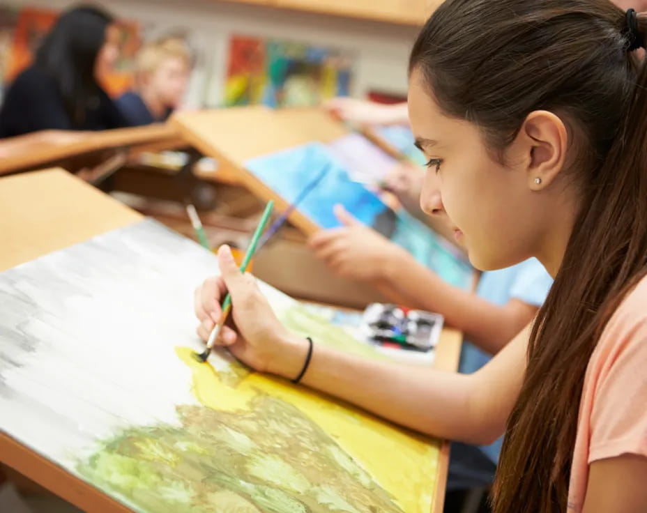 a young girl painting