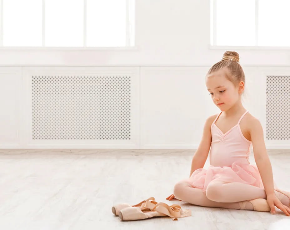 a girl sitting on the floor