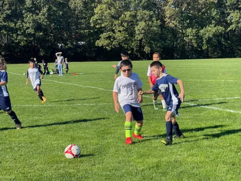 a group of kids playing football