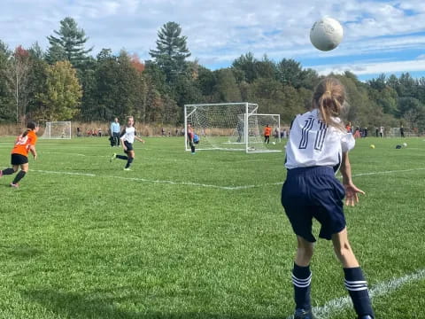 a group of people play football