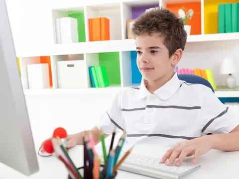 a boy using a laptop
