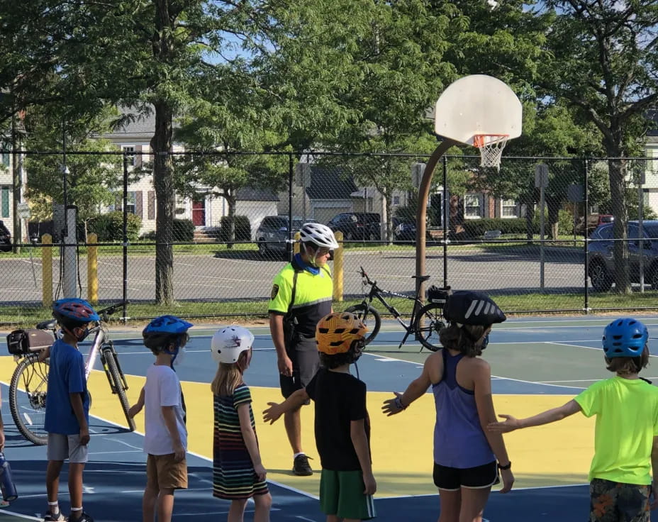 a group of kids playing basketball