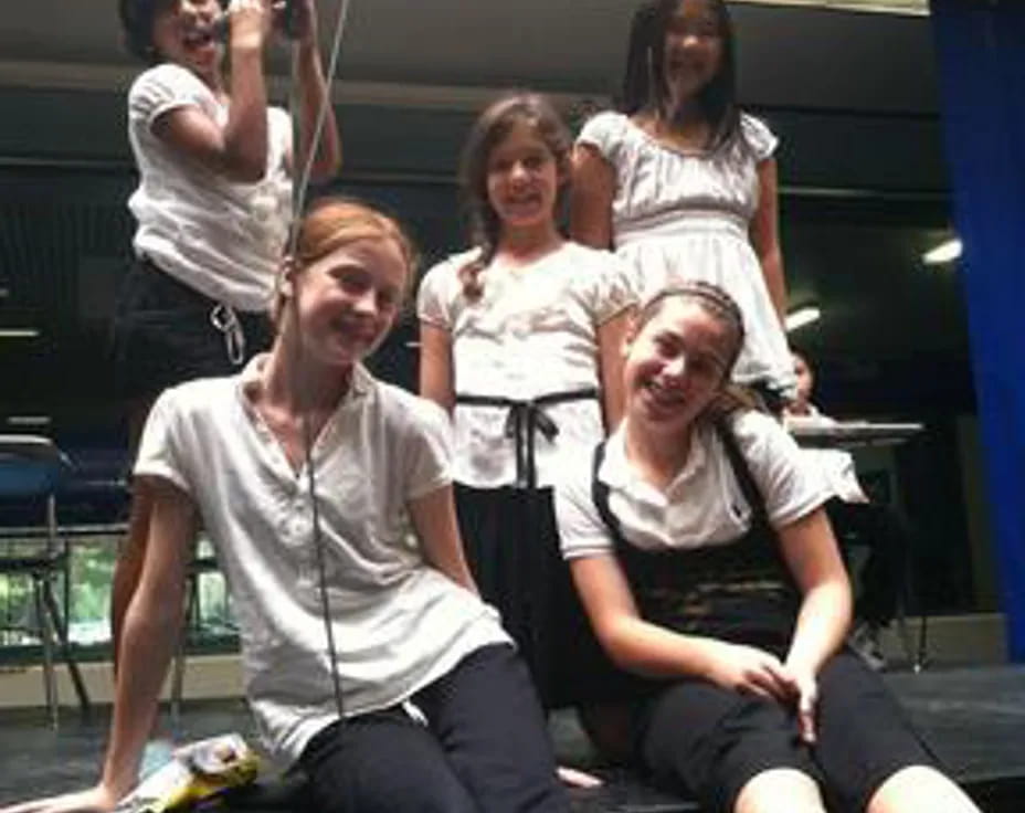 a group of women posing for a photo
