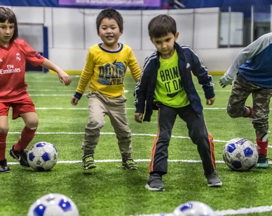 kids playing football on a field