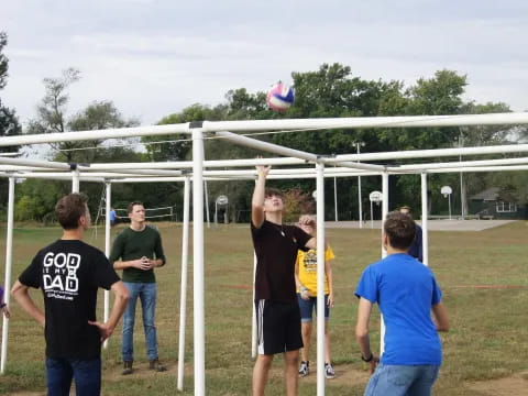 a group of people playing frisbee