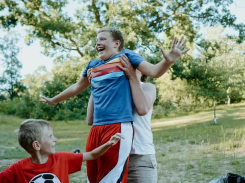 a person holding a boy