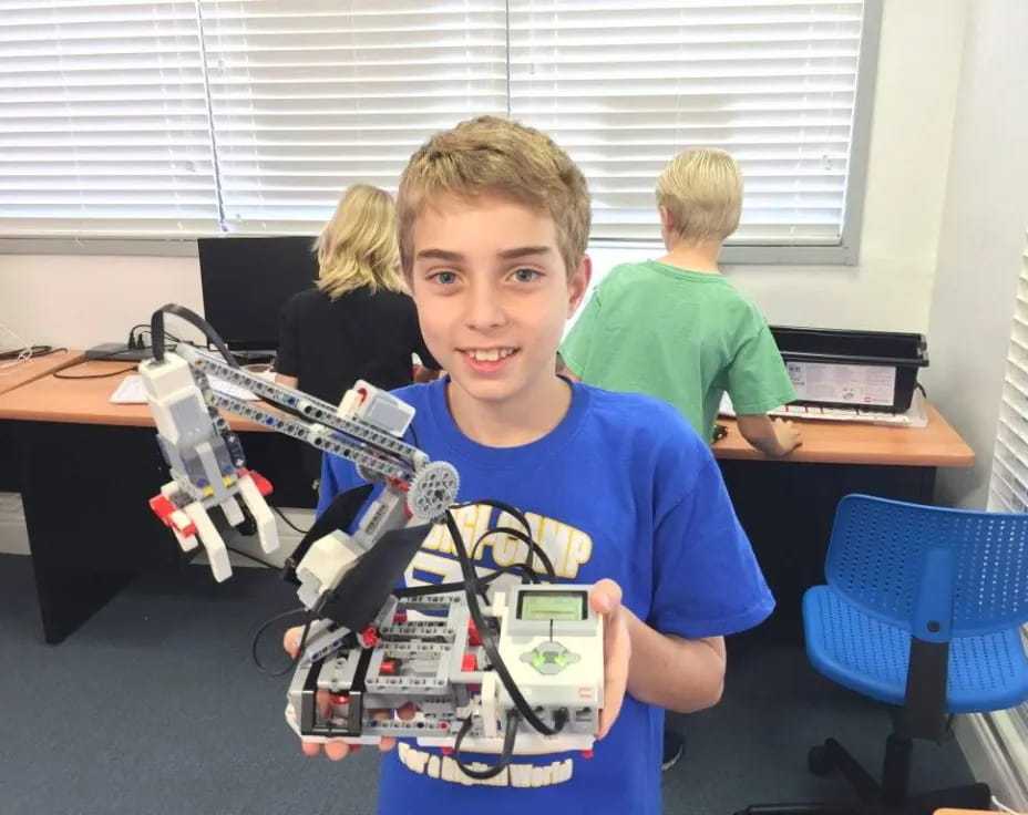 a boy holding a toy