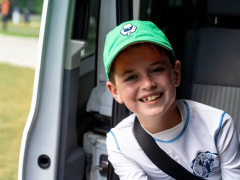 a boy smiling for the camera