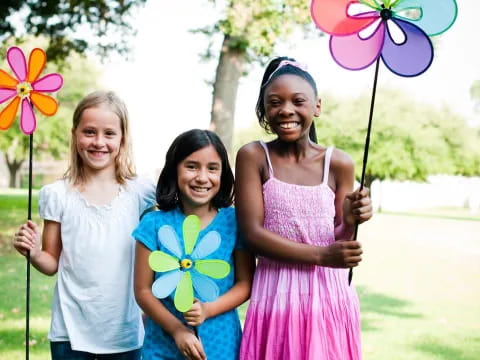 a group of women holding flowers