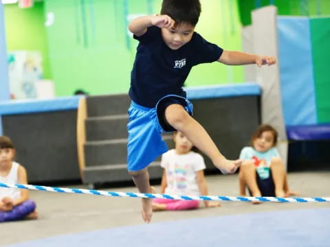 a boy jumping in the air
