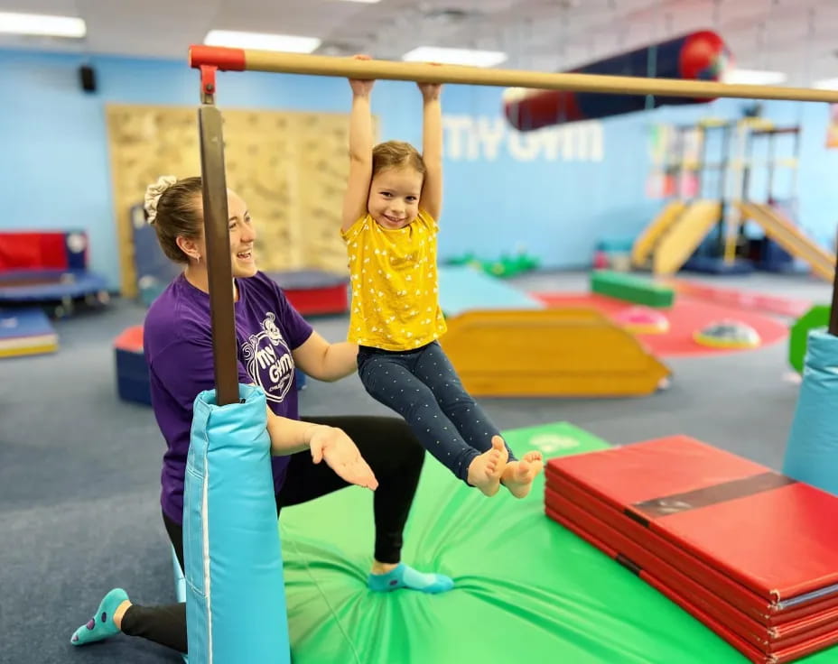 a woman and a child on a bar