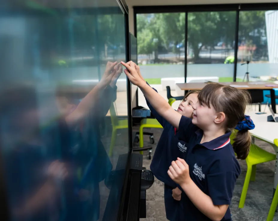 a girl painting a window