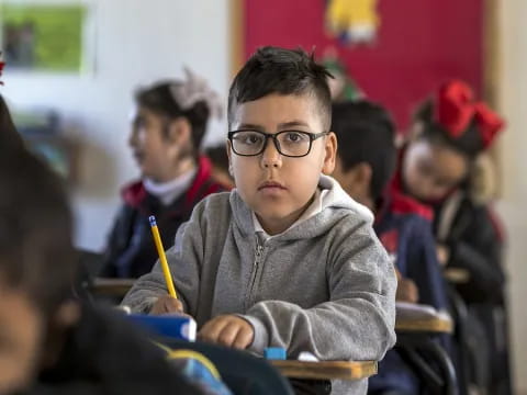 a boy wearing glasses