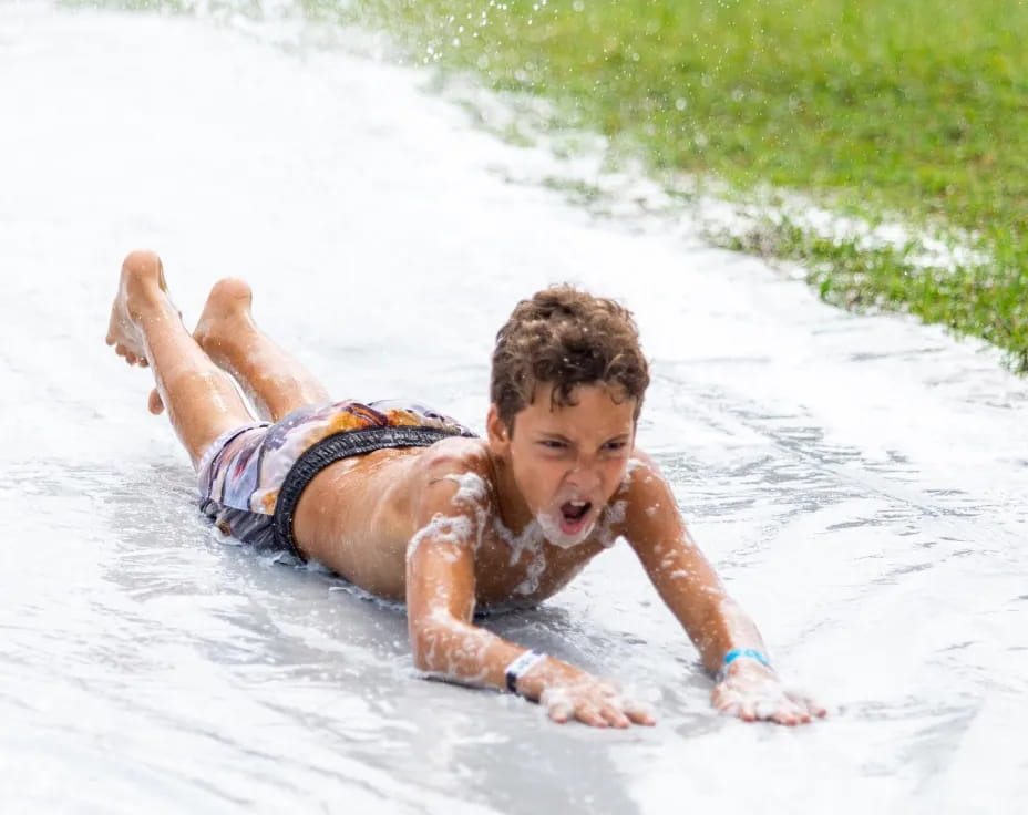a boy playing in the water