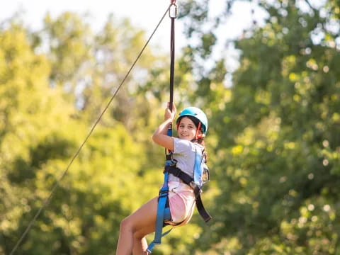 a girl on a zip line