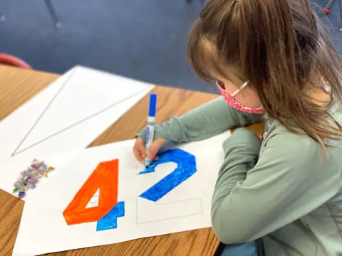 a young girl painting