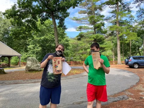 two men holding signs