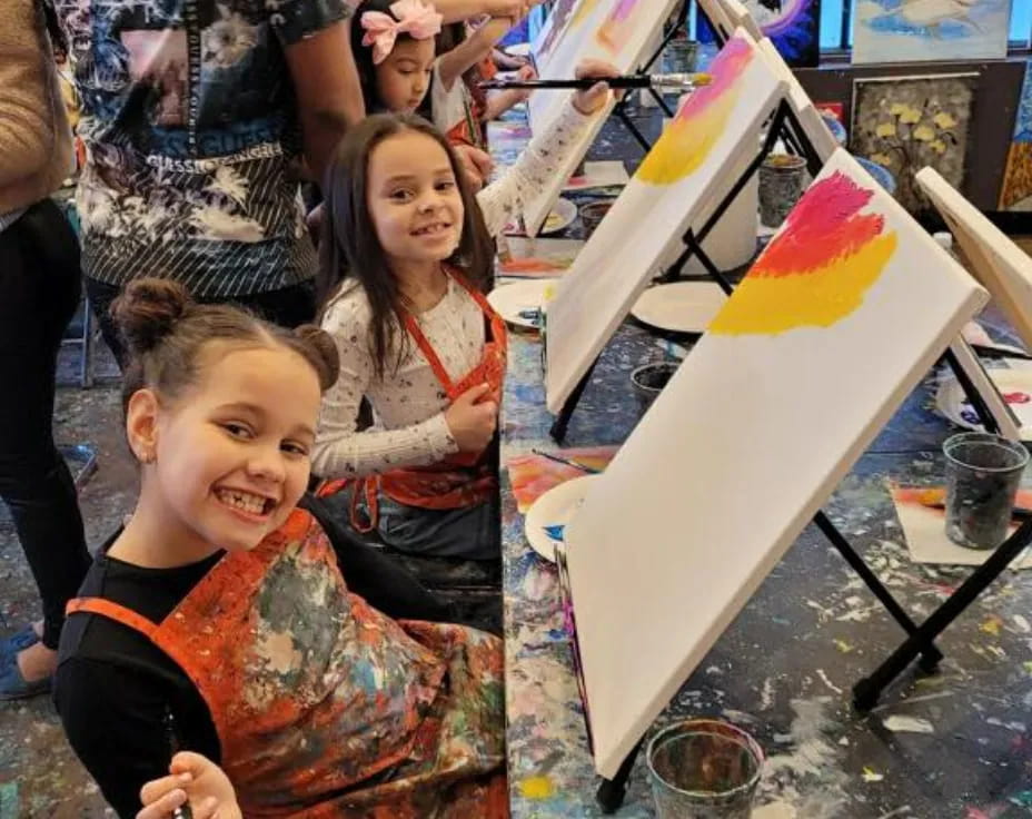 a group of children painting