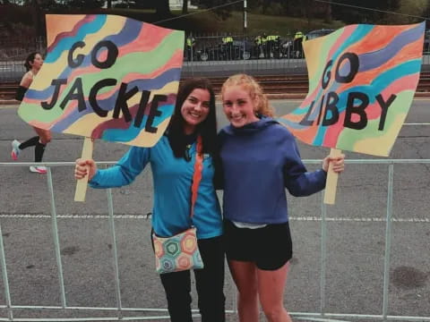 two women holding flags