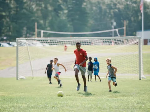 a group of kids playing football