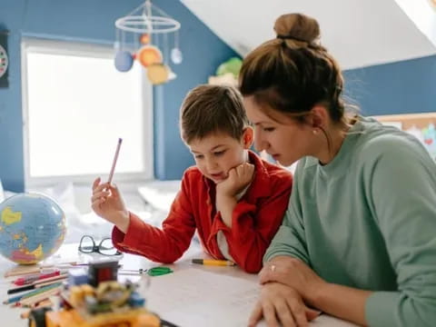 a person and a child painting