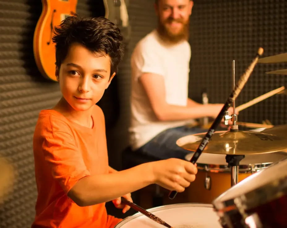 a boy playing drums