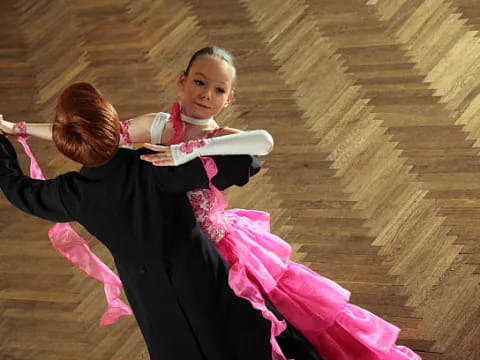two women in black dresses