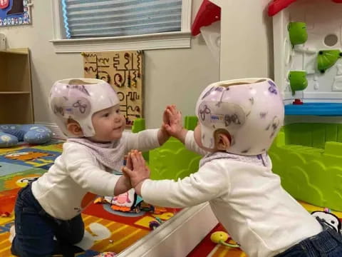a baby playing with a toy
