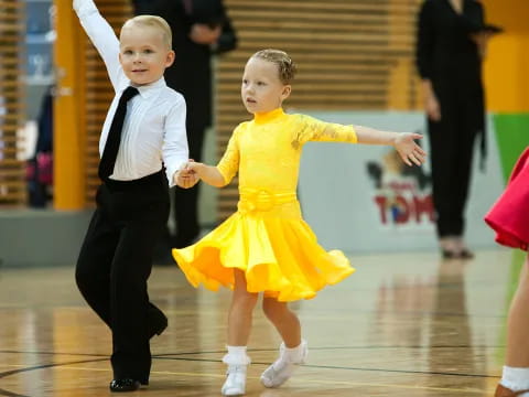a boy and girl dancing