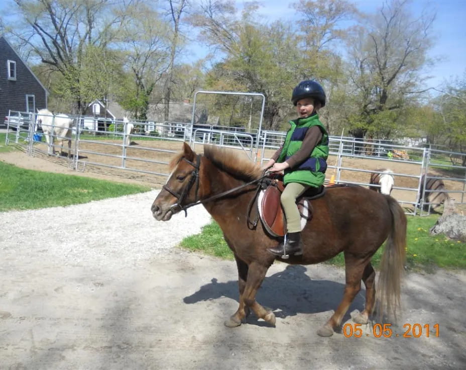 a girl riding a horse