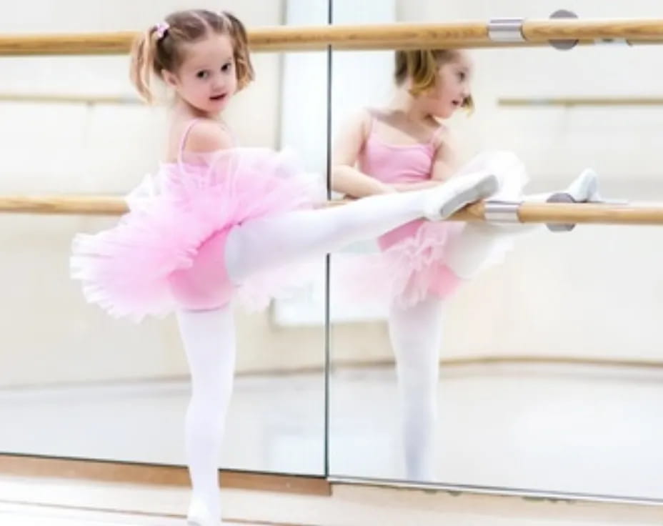 two girls in pink dresses