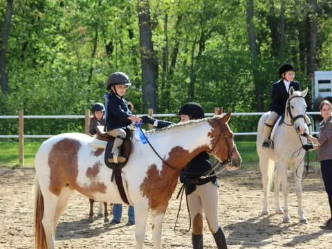 a group of people on horses