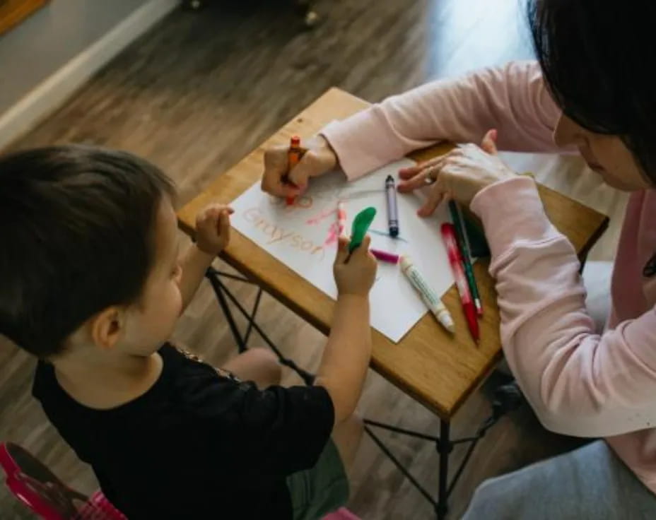 a person and a child painting