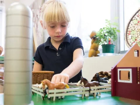 a young boy playing with a toy