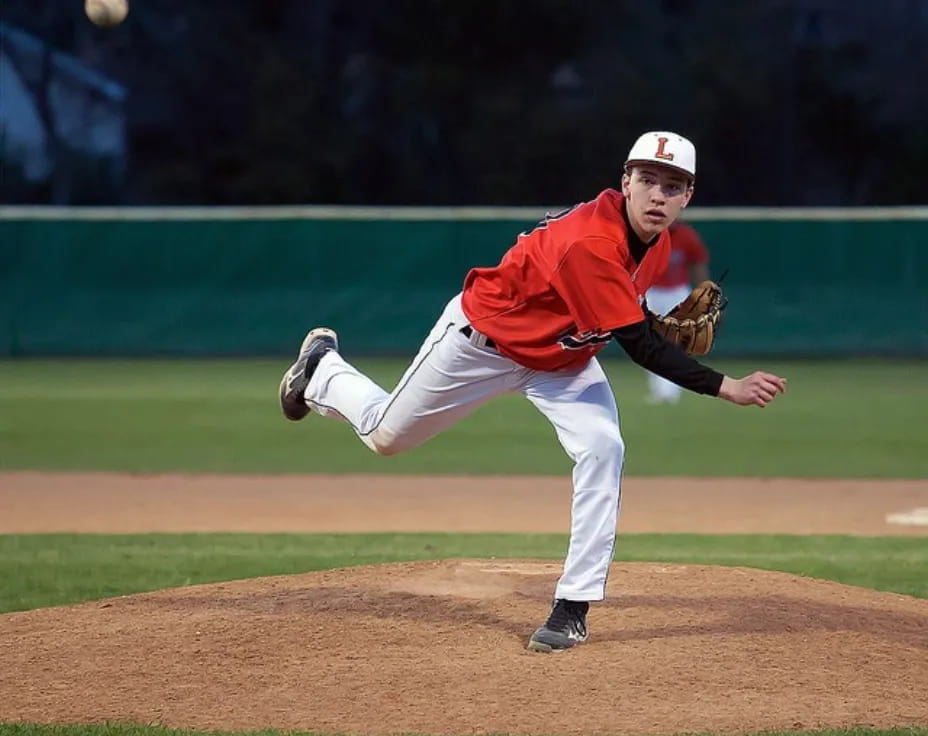 a baseball player throwing a ball
