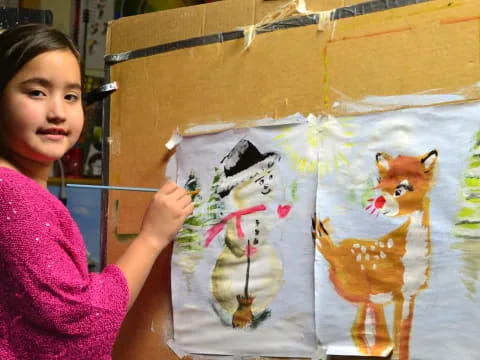 a woman holding a drawing