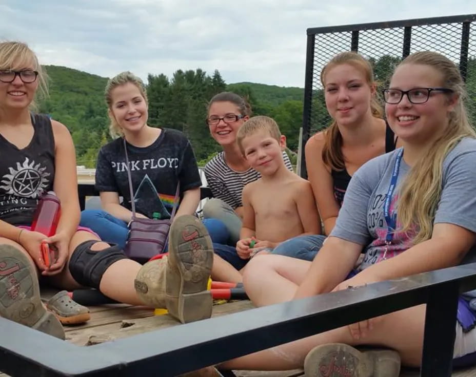 a group of people sitting on a boat