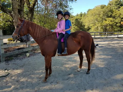 two girls on a horse