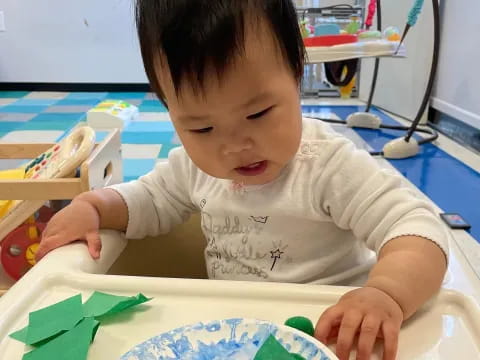 a child painting on a table