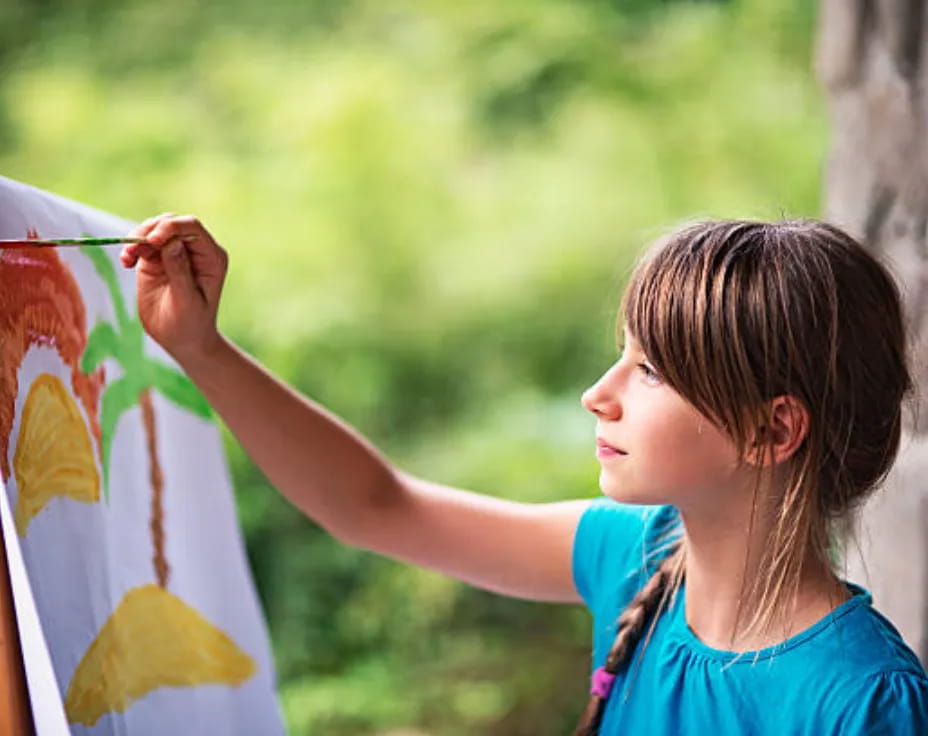 a young girl painting