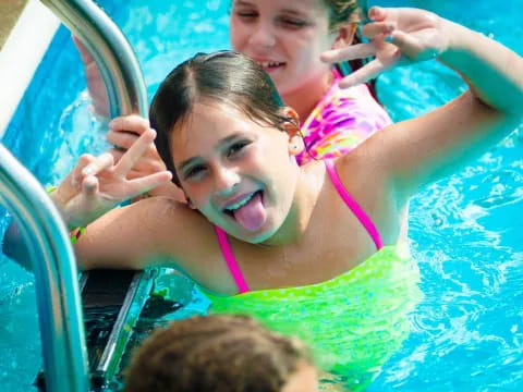 a group of children in a pool