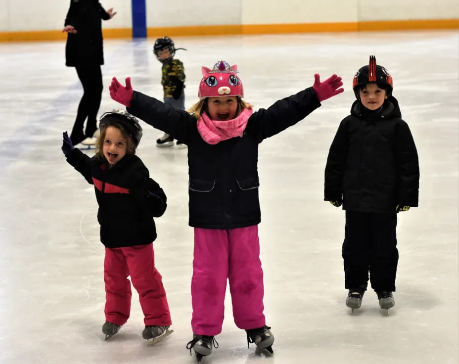 a group of people on an ice rink