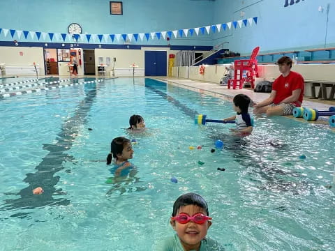 a group of people in a pool