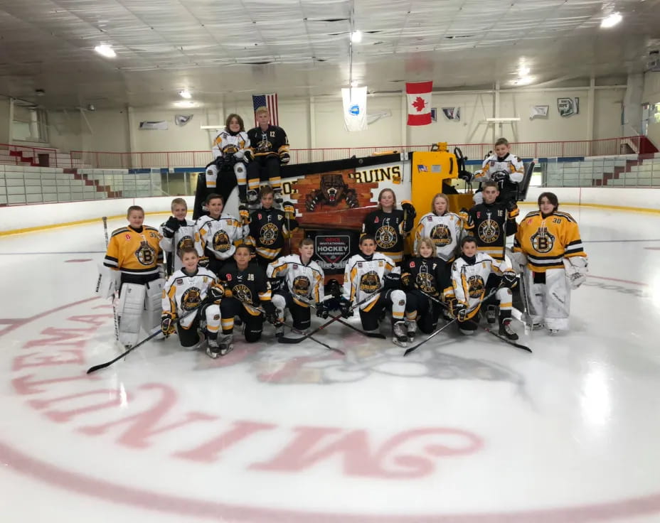 a hockey team posing for a photo
