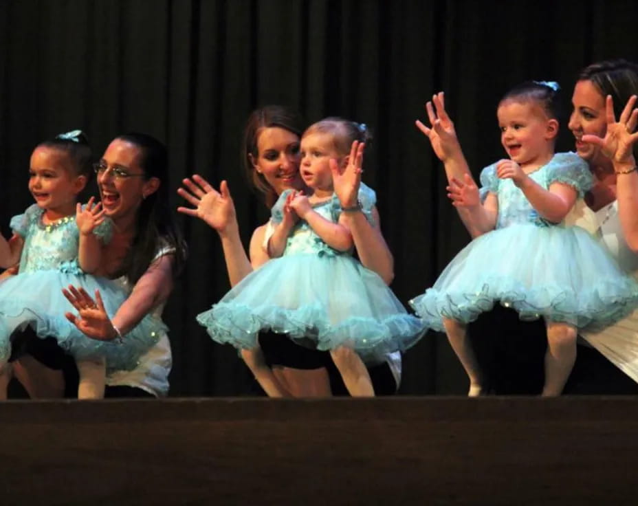 a group of girls in dresses